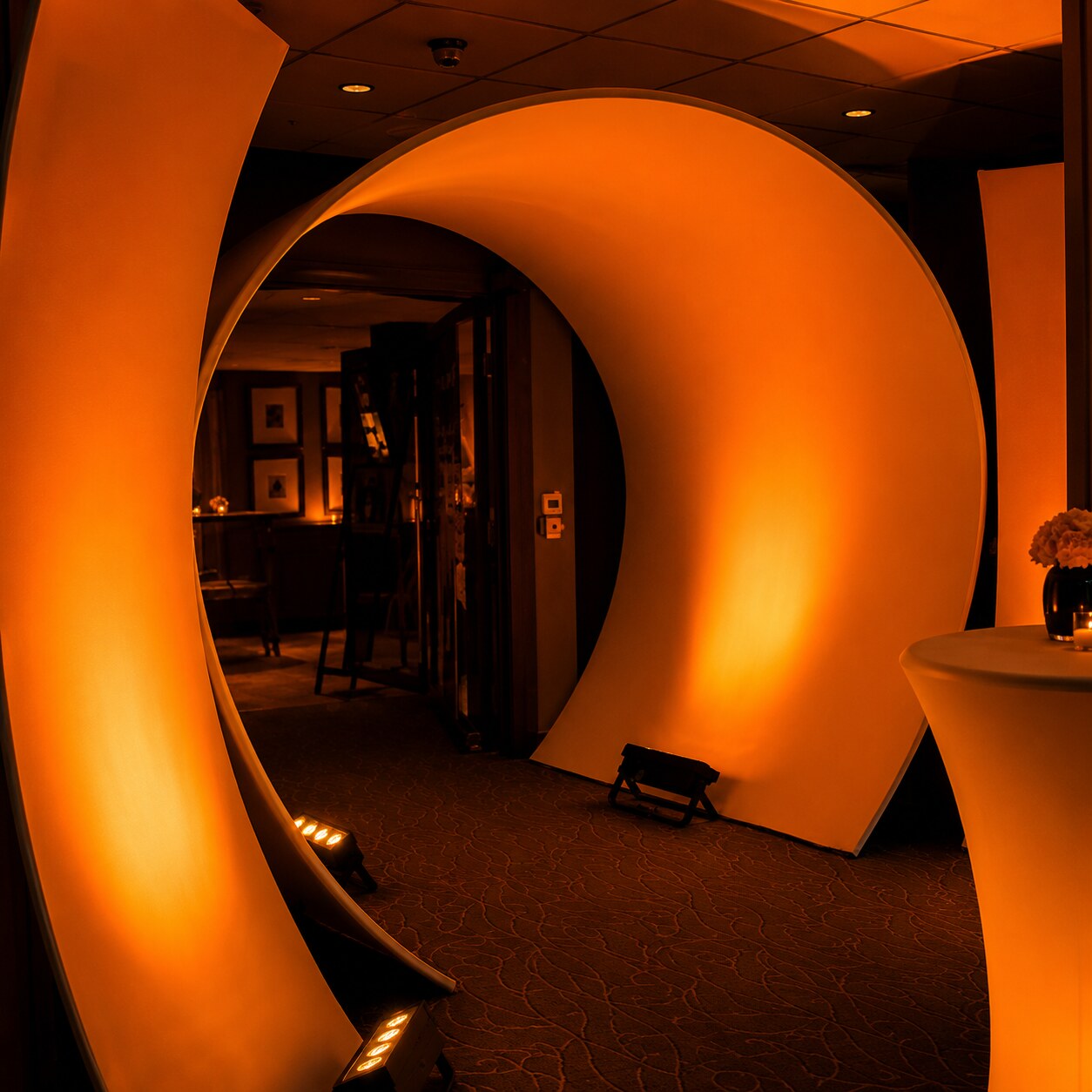 Illuminated amber circular lattice archway entrance