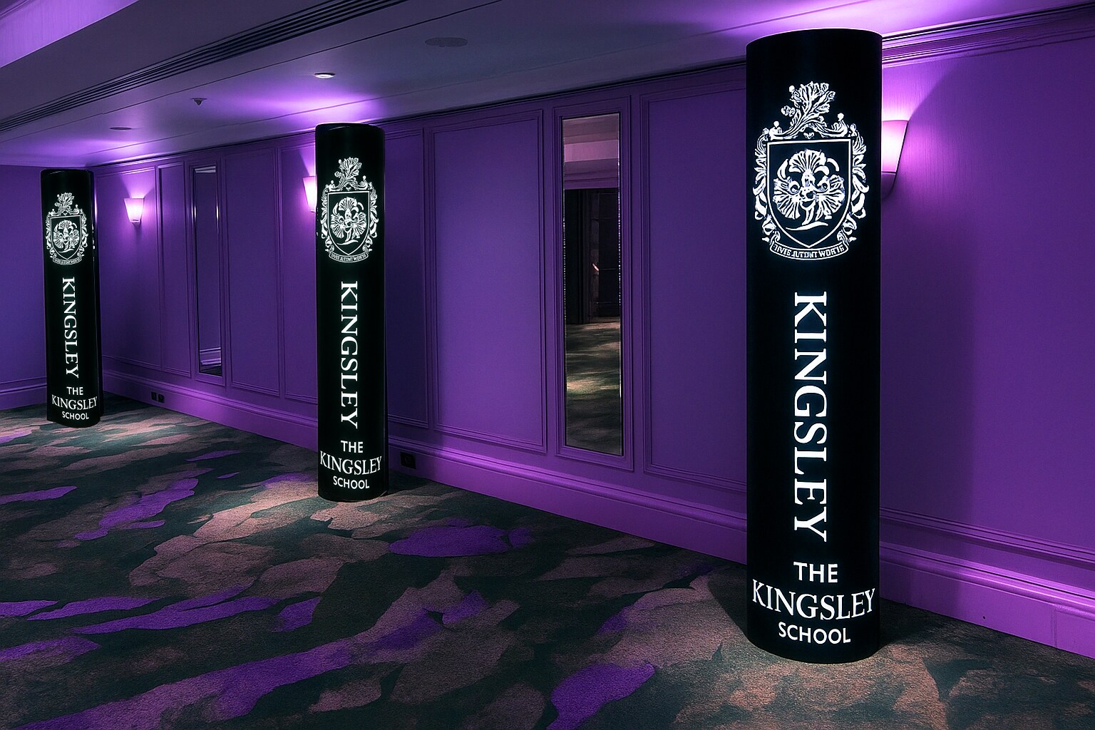 The Kingsley School crest branded entrance pillars in a corridor