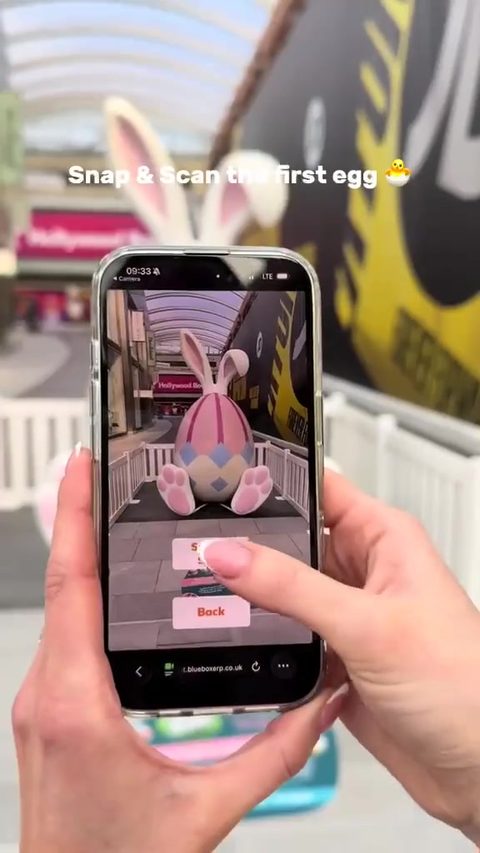 Shopper scanning a QR code checkpoint